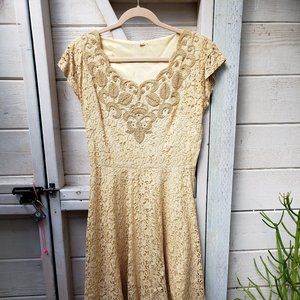 Vintage eyelet ivory dress with intricate beading and applique